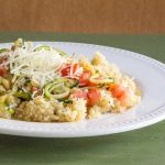 Spiralized zucchini cooked in a scampi sauce and served over couscous.