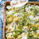 Zucchini and corn tart with mozzarella cheese, mint and basil with text overlay.