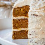 My favorite carrot cake with detailed instructions for assembling a triple-layer cake. The cake includes apple sauce, and is topped with cream cheese, and an optional flurry of coconut flakes.