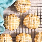 Pennsylvania Dutch spice drop cookies dotted with currents, drizzled with orange icing for Christmas.