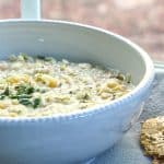 A bowl of Ashe Mast, a Persian yogurt soup topped with chopped mint.