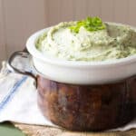 Mashed celery root with watercress, topped with scallions.