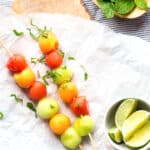 Honey and lime glazed melon balls with mint.