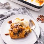 A piece of pecan cobbler on a plate.