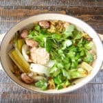 Vegetables all in water in a large pot ready to make broth.