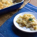 A plate of cauliflower and pasta in a bang bang sauce.