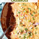 Cornbread topped chili in a large skillet with text overlay.