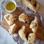 Pieces of fougasse on a cutting board with olive oil.